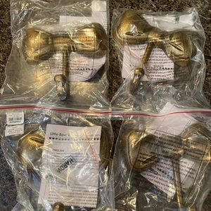 Crate & Barrel set of 4 bow wall hooks